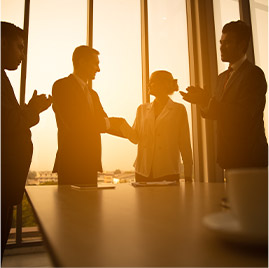 silhouettesucessful-business-deal-is-made-after-the-joint-company-meeting-for-company-profitsun-set